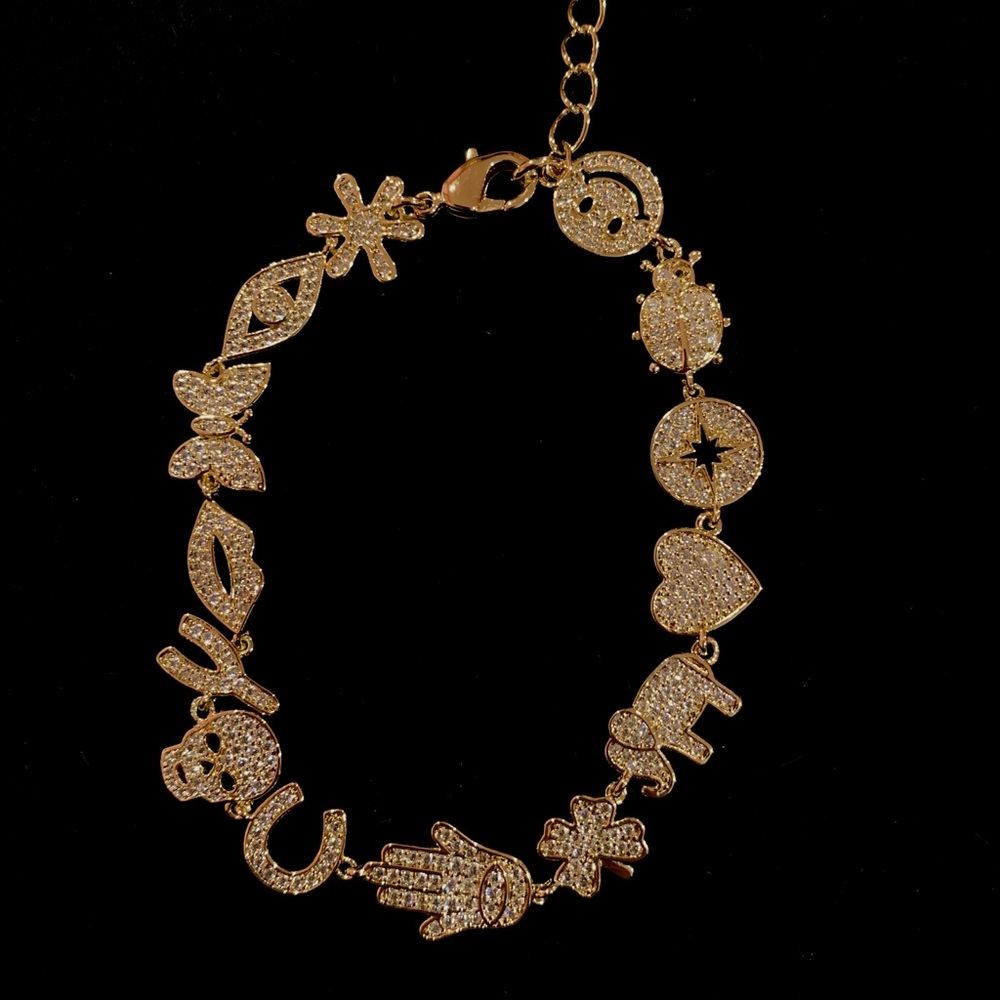 Gold and cubic zirconia charm bracelet